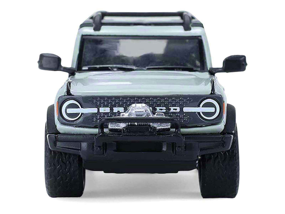 2021 Ford Bronco 4-Door Badlands Cactus Gray with Black Top and Motorcycle with Utility Trailer "Hitch & Tow" Series 33 1/64 Diecast Model Cars by Greenlight