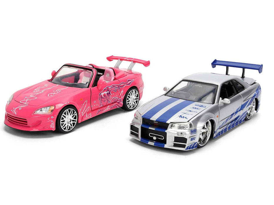 Brian's Nissan Skyline GT-R (R34) Silver Metallic with Blue Stripes and Suki's Honda S2000 Pink with Graphics Set of 2 Cars "Fast & Furious 25th Anniversary" "Fast & Furious" Series 1/24 Diecast Model Cars by Jada