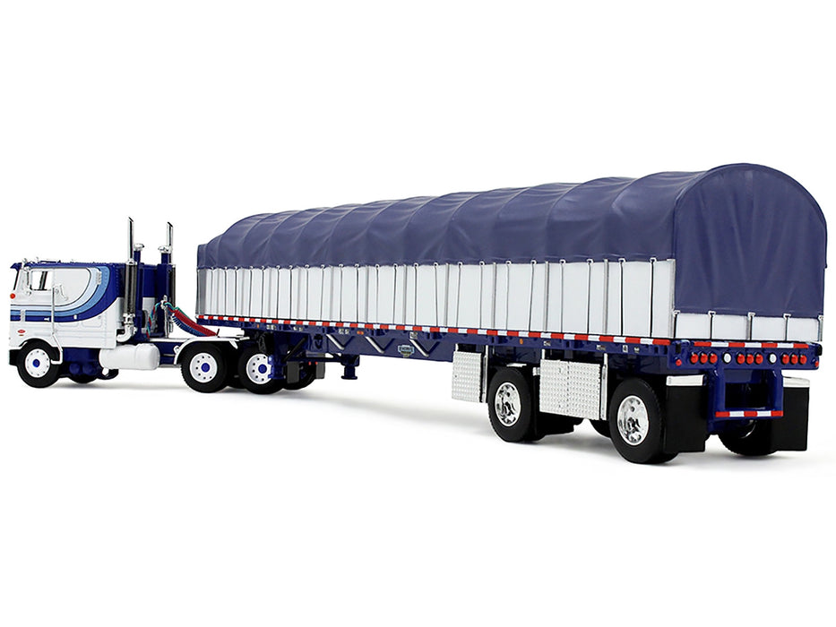 Peterbilt 352 COE 110" Sleeper and 53' Wilson Roadbrute Flatbed Trailer with Covered Wagon White with Blue Stripes 1/64 Diecast Model by DCP/First Gear
