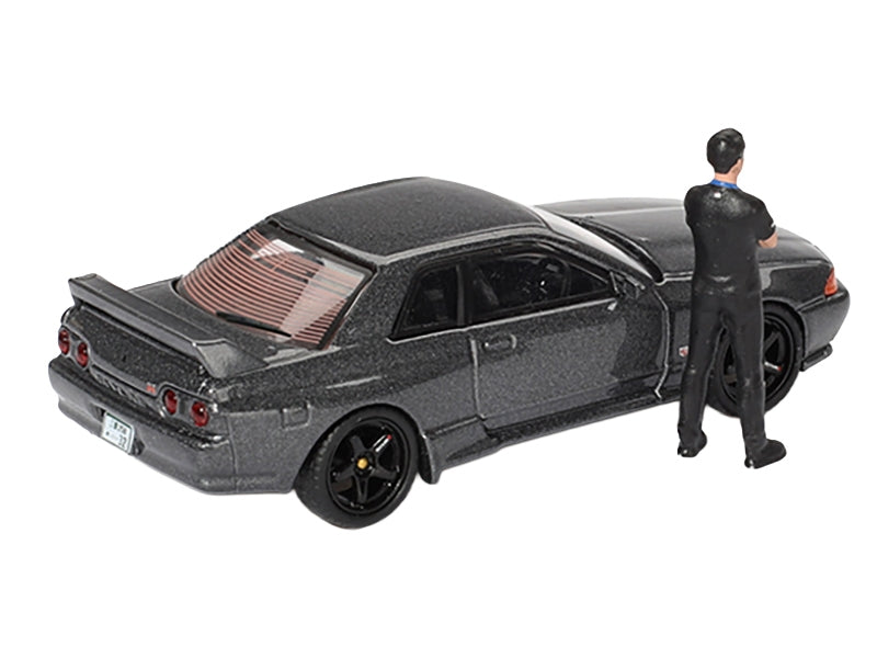 Nissan Skyline GT-R (R32) RHD (Right Hand Drive) Gunmetal Gray Metallic with Tsugio Matsuda Figure Limited Edition 1/64 Diecast Model Car by Mini GT